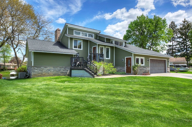 view of front of home featuring stone siding, an attached garage, cooling unit, driveway, and a chimney