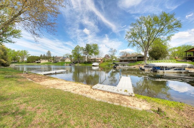 dock area featuring a water view and a residential view