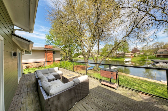 deck with a water view and an outdoor hangout area