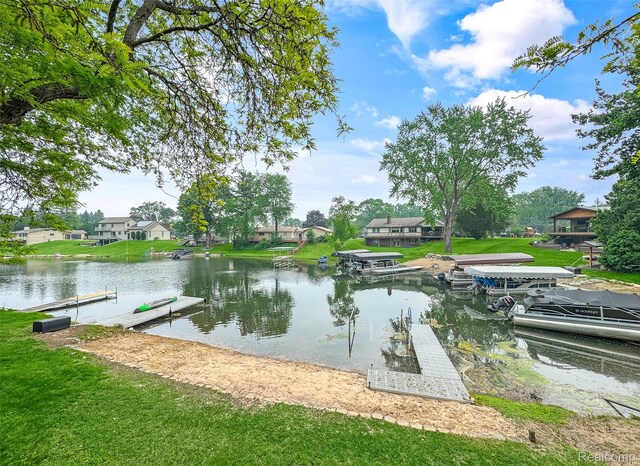 3978 Chanda, Highland, MI 48356 - dock featuring a water view, a lawn, and a residential view