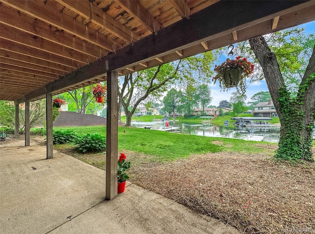 3978 Chanda, Highland, MI 48356 - view of green lawn with a water view and a patio