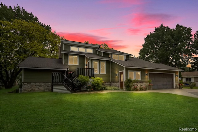 3978 Chanda, Highland, MI 48356 - view of front of property featuring stone siding, driveway, and a front lawn