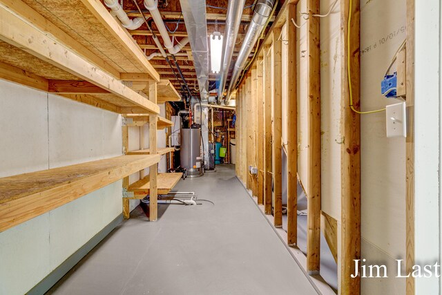 unfinished basement with water heater
