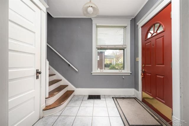 2152 6th St, Bay City, MI 48706 - foyer featuring baseboards, stairway, ornamental molding, and tile patterned floors