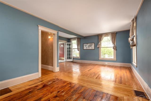2152 6th St, Bay City, MI 48706 - empty room with baseboards and wood-type flooring