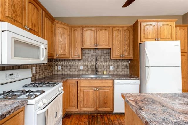 2152 6th St, Bay City, MI 48706 - kitchen with white appliances, a sink, ceiling fan, and backsplash