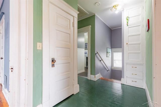 2152 6th St, Bay City, MI 48706 - hall featuring an upstairs landing, wood finished floors, baseboards, and ornamental molding