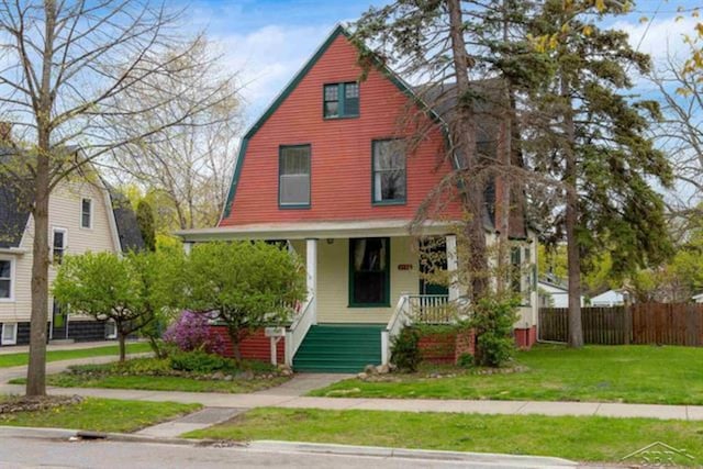 2152 6th St, Bay City, MI 48706 - view of front of house with covered porch and a gambrel roof