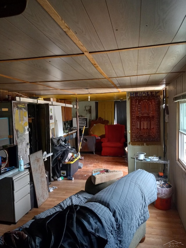 1677 S Sumac Ave, White Cloud, MI 49349 - living room featuring wood finished floors, wooden ceiling, and wooden walls