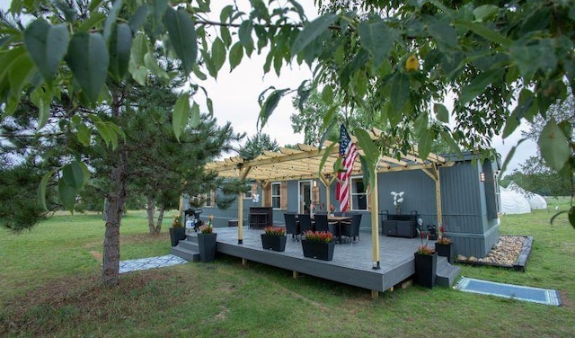 11930 State Rd, Cadillac, MI 49601 - back of house with a pergola, a deck, and a lawn