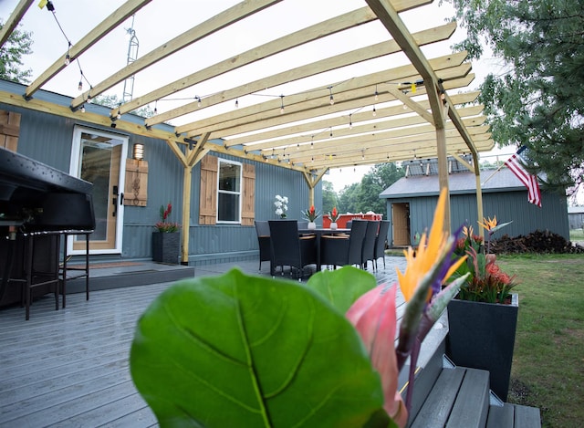11930 State Rd, Cadillac, MI 49601 - wooden terrace featuring a pergola and outdoor dining area