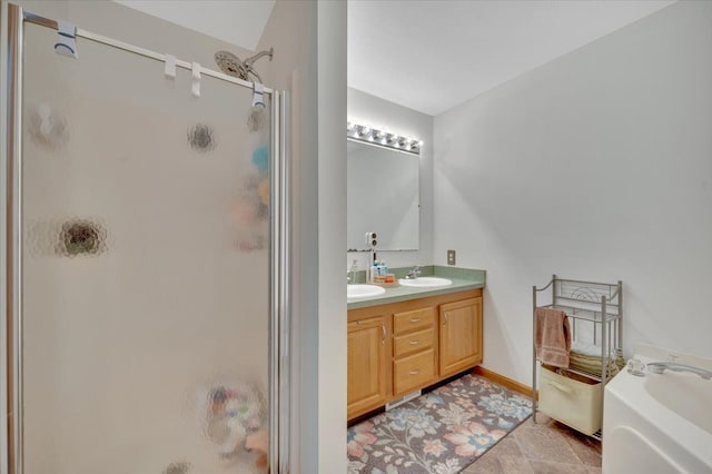 full bathroom featuring a shower stall, double vanity, a garden tub, and baseboards