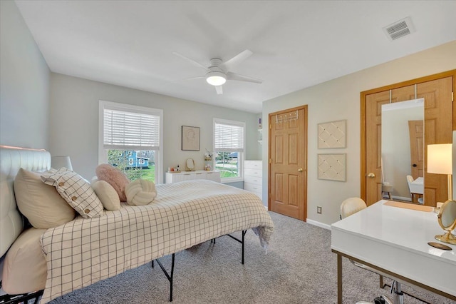 bedroom with carpet, baseboards, and a ceiling fan