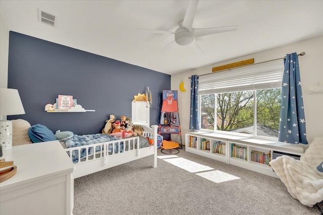 carpeted bedroom with a ceiling fan