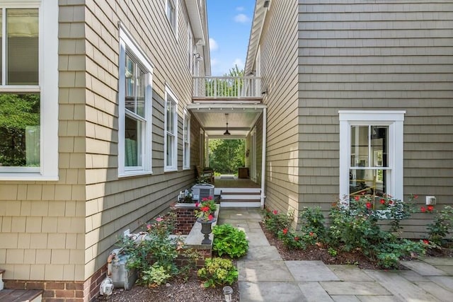 view of property exterior featuring a balcony
