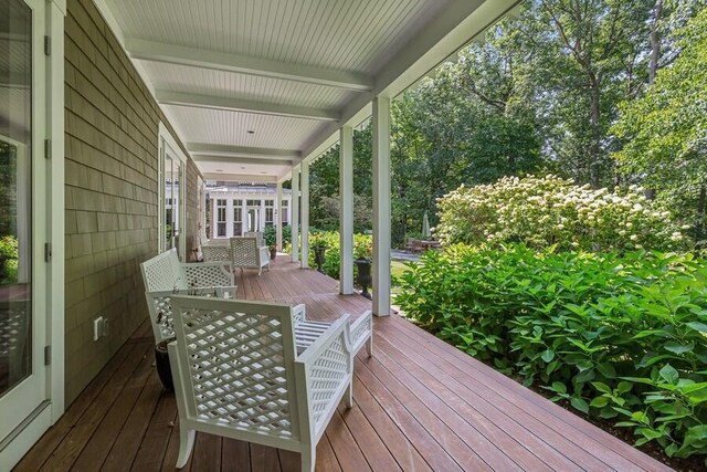 wooden terrace with a porch