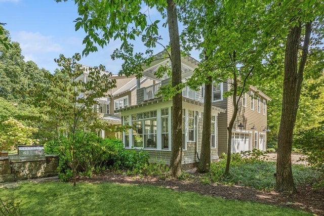view of side of home featuring a lawn