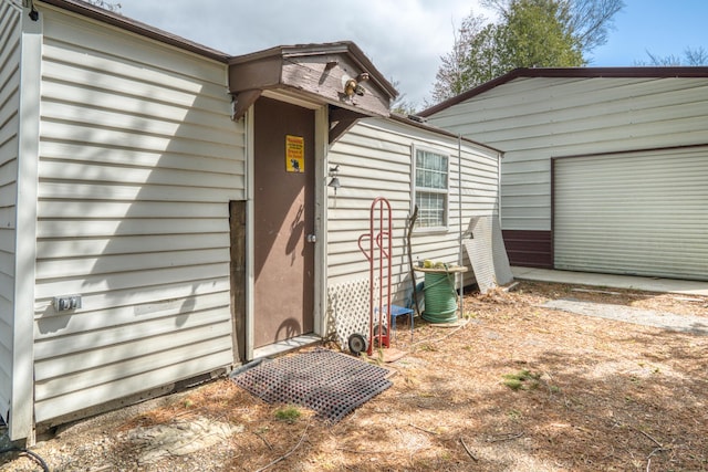 321 N Norman St, Barryton, MI 49305 - view of exterior entry with a garage