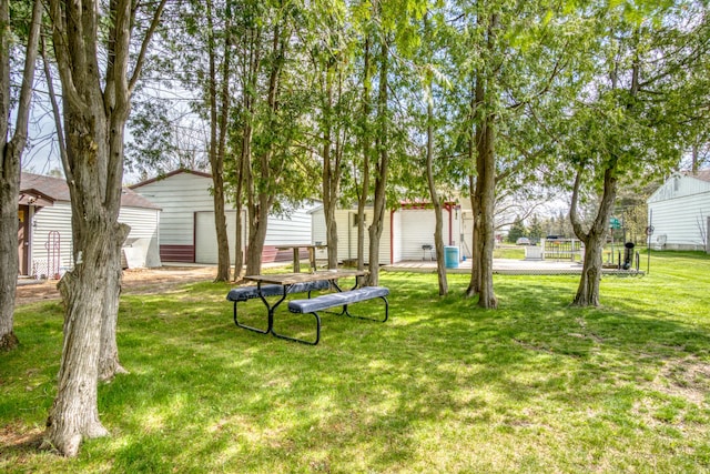 321 N Norman St, Barryton, MI 49305 - view of grassy yard with an outbuilding and a storage shed