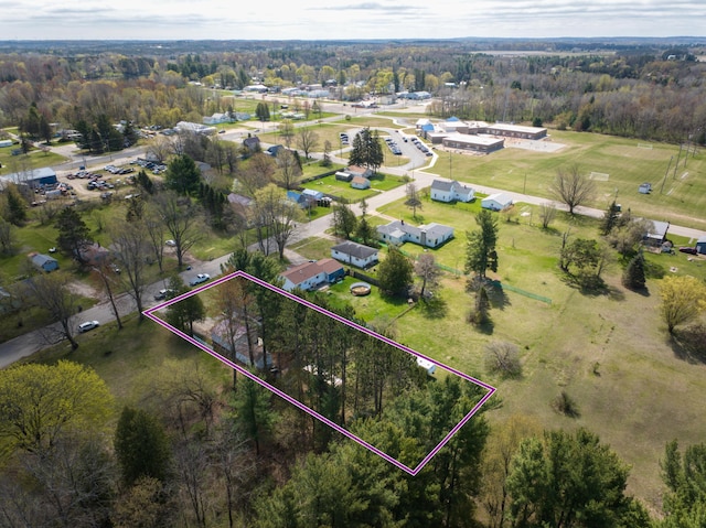 321 N Norman St, Barryton, MI 49305 - aerial view of property's location with property boundaries highlighted and a heavily wooded area