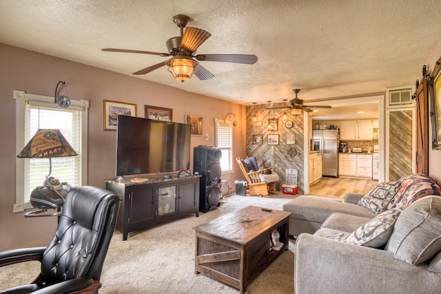 321 N Norman St, Barryton, MI 49305 - living room featuring a textured ceiling, ceiling fan, and plenty of natural light