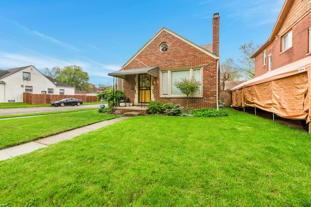 3901 Bedford St, Detroit, MI 48224 - view of front of house with a chimney and brick siding