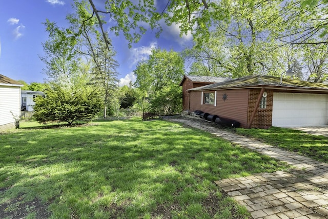 1620 Whittier Rd, Ypsilanti, MI 48197 - view of grassy yard with a garage