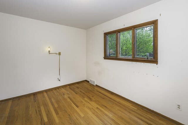 1620 Whittier Rd, Ypsilanti, MI 48197 - unfurnished room with wood finished floors and baseboards