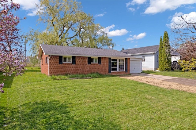3935 Orr Dr, North Branch, MI 48461 - single story home with driveway, a garage, a front yard, and brick siding