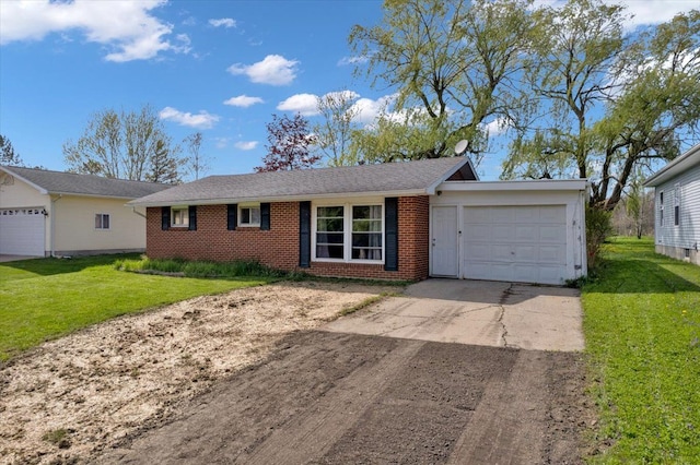 3935 Orr Dr, North Branch, MI 48461 - single story home with an attached garage, concrete driveway, brick siding, and a front lawn