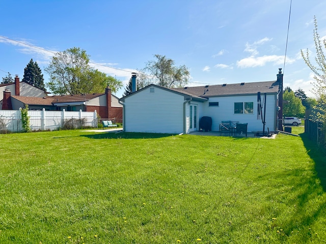 41371 Hamilton Dr, Sterling Heights, MI 48313 - rear view of house with a chimney