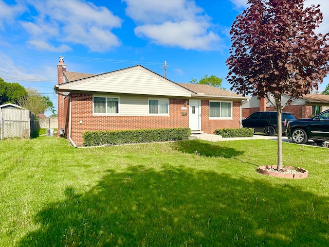 41371 Hamilton Dr, Sterling Heights, MI 48313 - view of front of house with brick siding and a chimney