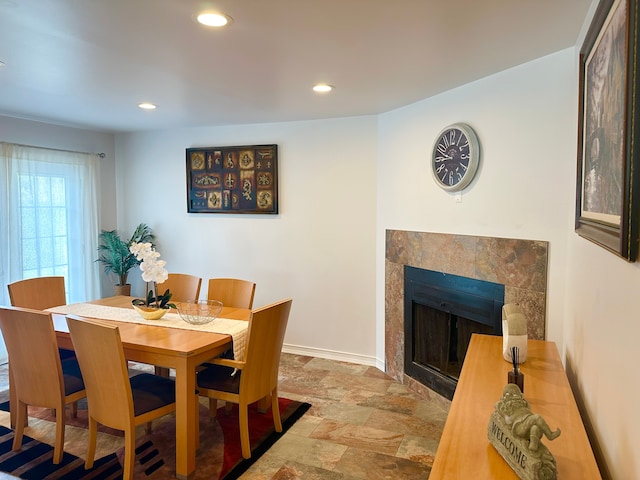 41371 Hamilton Dr, Sterling Heights, MI 48313 - dining space with baseboards, recessed lighting, a tiled fireplace, and stone finish flooring