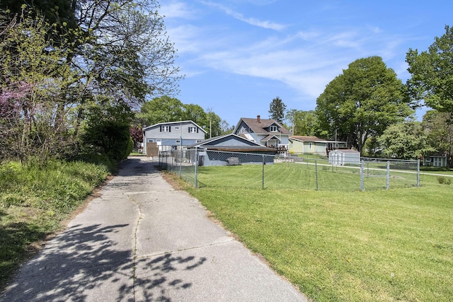 view of front of house with driveway and a chimney