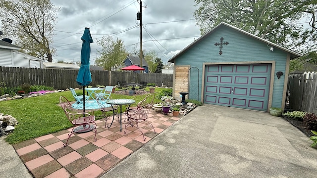 detached garage with concrete driveway