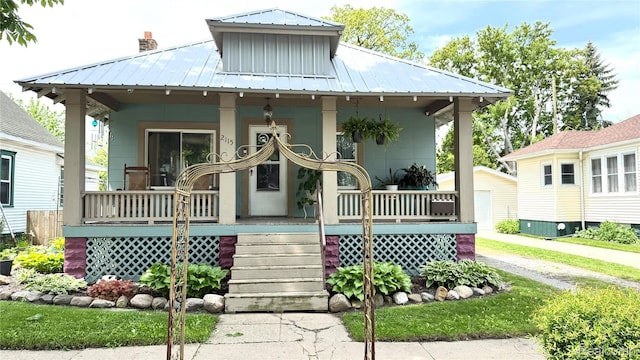 2115 Willow St, Port Huron, MI 48060 - view of front of property featuring a porch and a metal roof