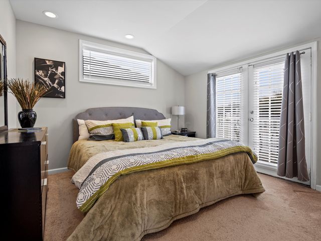 bedroom with carpet floors, access to outside, vaulted ceiling, baseboards, and recessed lighting