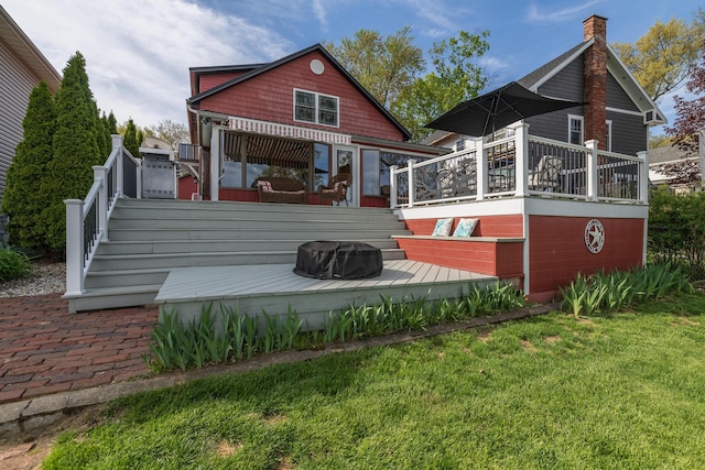 8811 Waruf Ave, Portage, MI 49002 - back of house with a deck, a chimney, a lawn, and stairs
