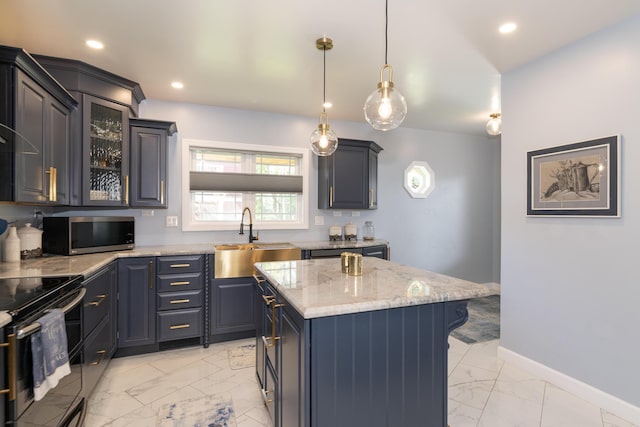 8811 Waruf Ave, Portage, MI 49002 - kitchen with stainless steel microwave, light marble finish floors, electric stove, a center island, and light stone counters