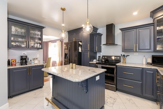 8811 Waruf Ave, Portage, MI 49002 - kitchen featuring appliances with stainless steel finishes, wall chimney range hood, light marble finish floors, a center island, and glass insert cabinets