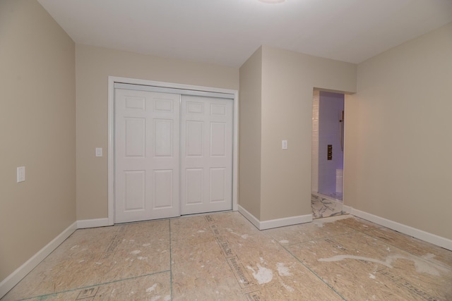 8811 Waruf Ave, Portage, MI 49002 - unfurnished bedroom featuring a closet and baseboards