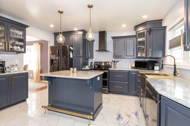 8811 Waruf Ave, Portage, MI 49002 - kitchen with wall chimney range hood, stainless steel appliances, light marble finish floors, light stone countertops, and glass insert cabinets