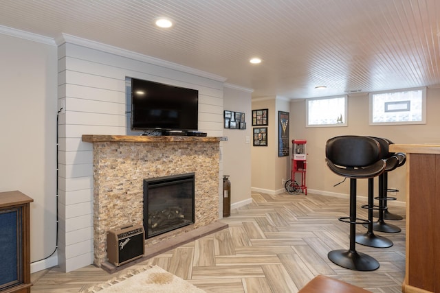8811 Waruf Ave, Portage, MI 49002 - living room with recessed lighting, crown molding, and a stone fireplace
