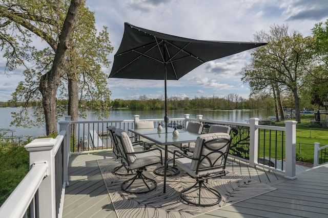 8811 Waruf Ave, Portage, MI 49002 - wooden terrace with a water view, outdoor dining space, and a lawn