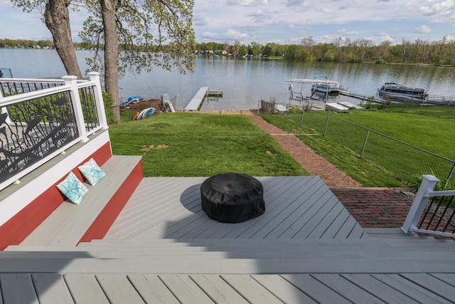 8811 Waruf Ave, Portage, MI 49002 - dock with an outdoor fire pit, boat lift, and a deck with water view