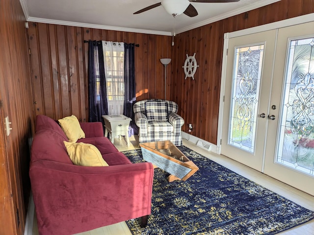 8811 Waruf Ave, Portage, MI 49002 - living area with crown molding, ceiling fan, french doors, and wooden walls