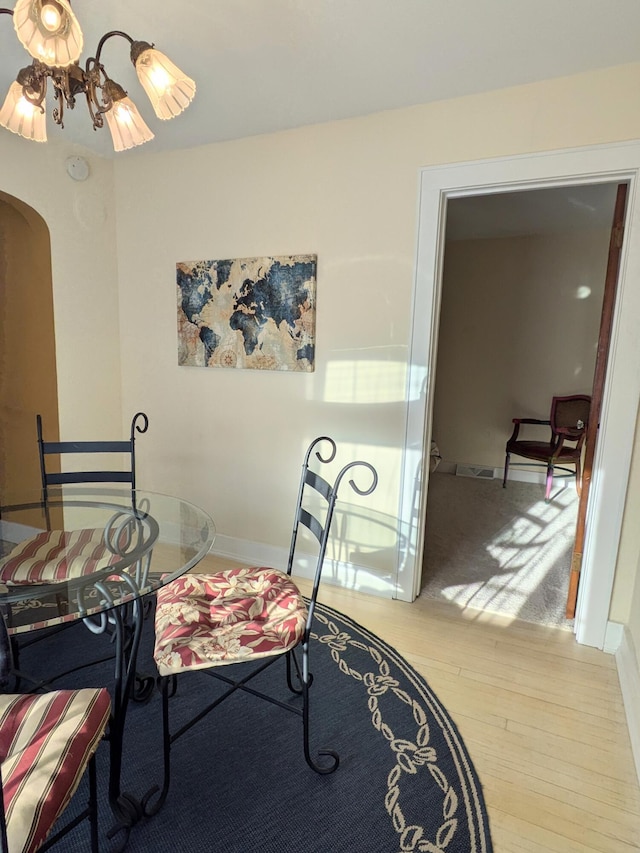 8811 Waruf Ave, Portage, MI 49002 - dining space with wood finished floors and arched walkways