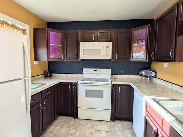8811 Waruf Ave, Portage, MI 49002 - kitchen featuring white appliances, light countertops, and dark brown cabinets