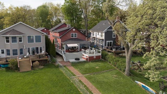 8811 Waruf Ave, Portage, MI 49002 - back of house featuring a wooden deck, a gazebo, stairway, a lawn, and view of wooded area