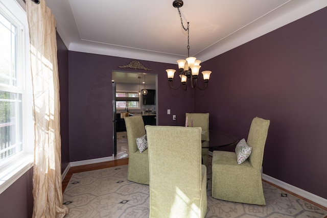 8811 Waruf Ave, Portage, MI 49002 - dining space featuring a chandelier and wood finished floors